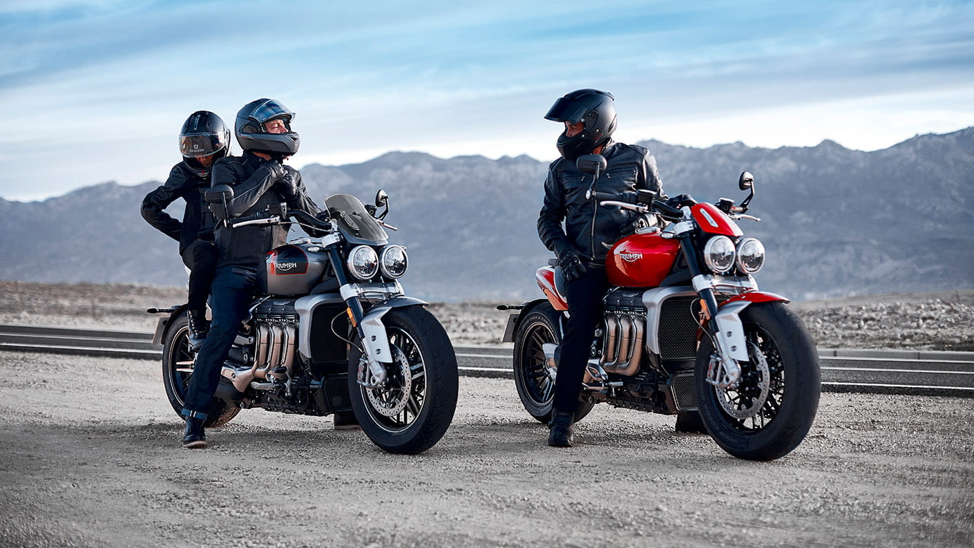 Riders stopping for a chat on their Triumph Rocket 3 GT in Silver Ice & Grey and Triumph Rocket 3 R in Korosi Red