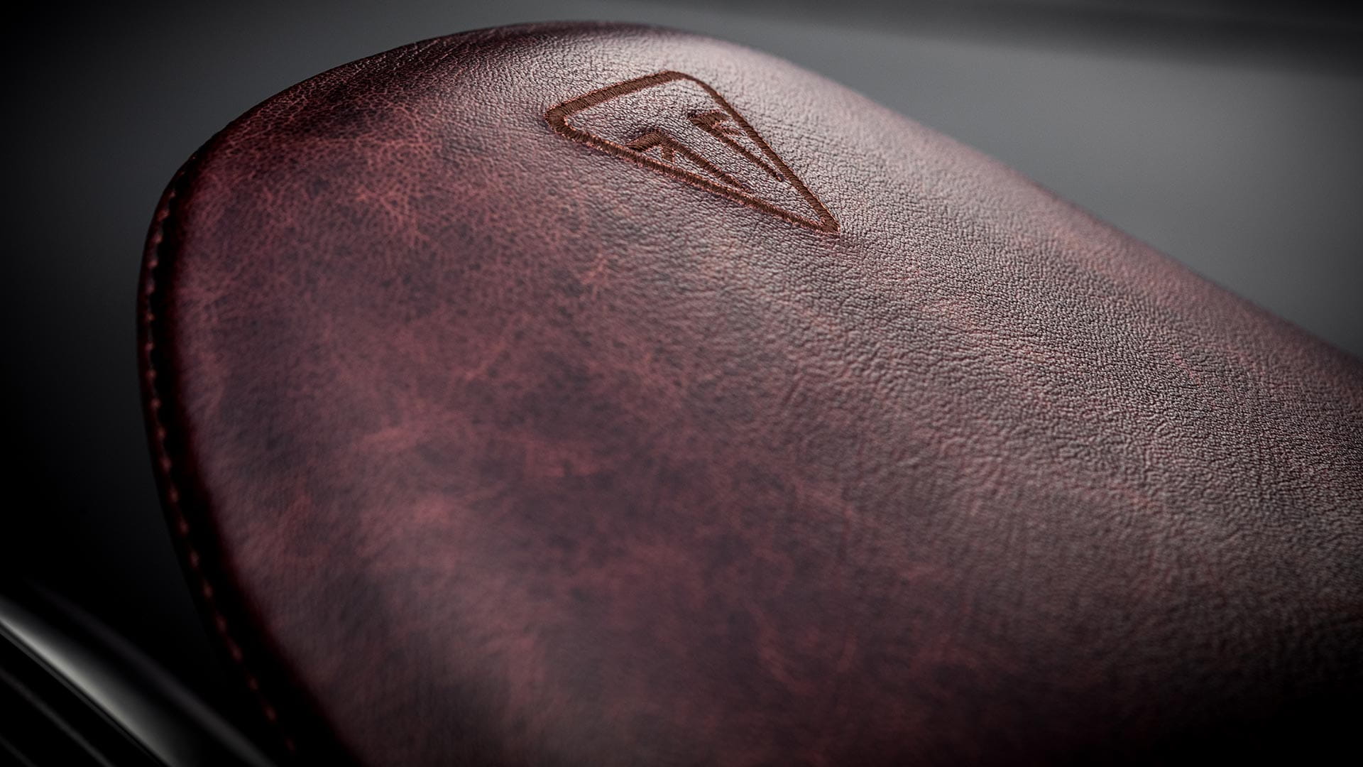 Close-up shot of the Triumph Bobber TFC's sculpted leather seat