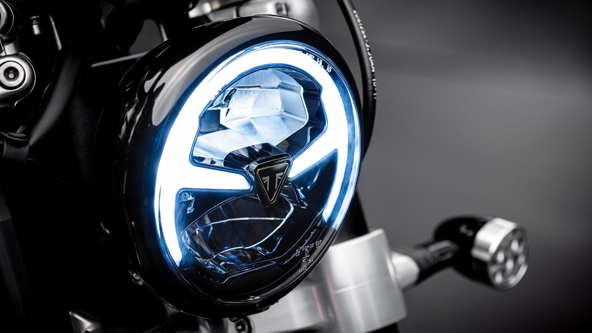 Close-up shot of the Triumph Bobber TFC's LED headlight