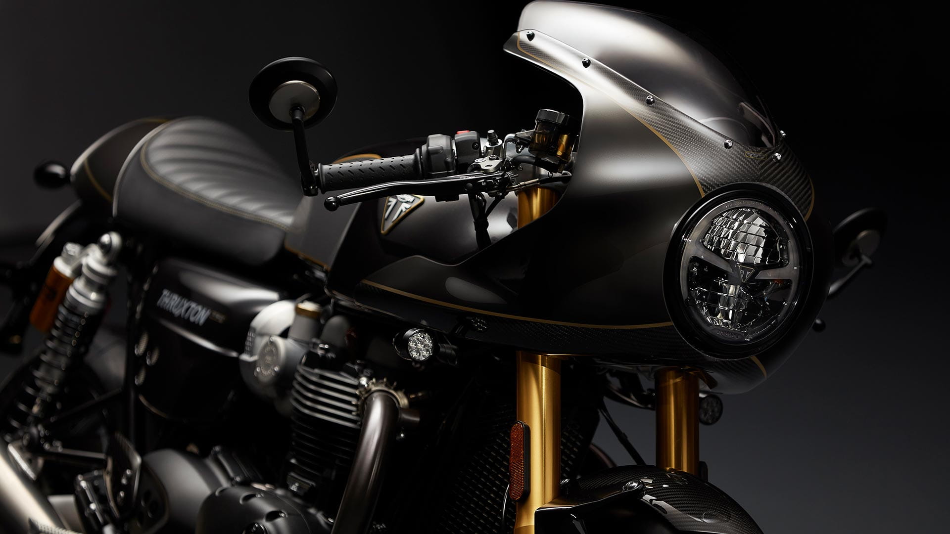 Triumph Thruxton TFC front shot featuring unique gold front forks and full fairing