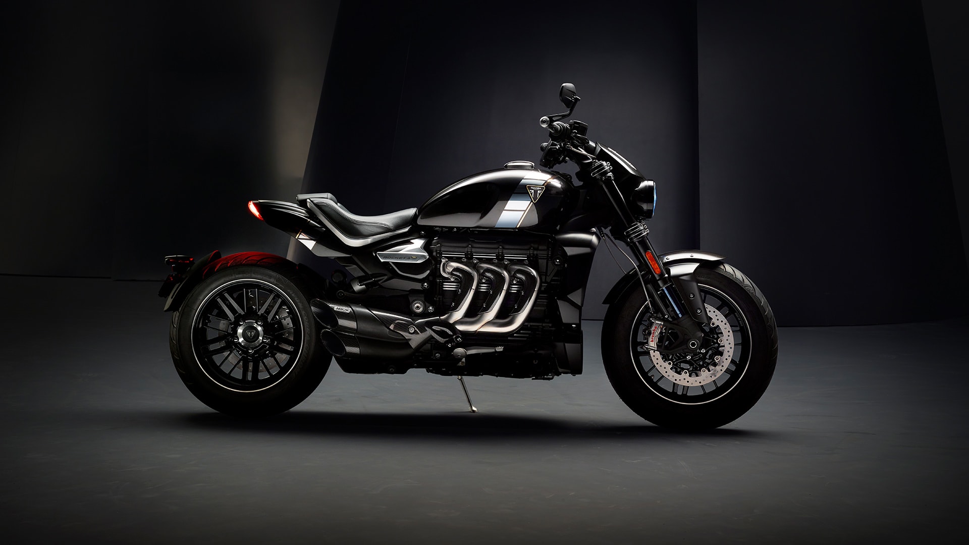 Triumph Rocket 3 TFC right hand side featuring iconic three header exhaust run with premium carbon fibre detailing