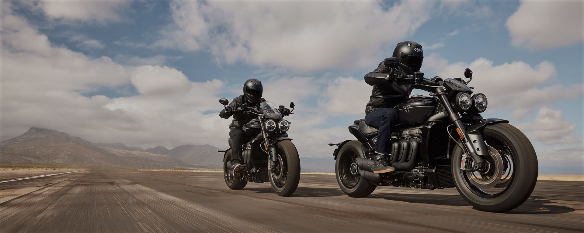 Triumph Rocket 3 Storm two riders on the road)