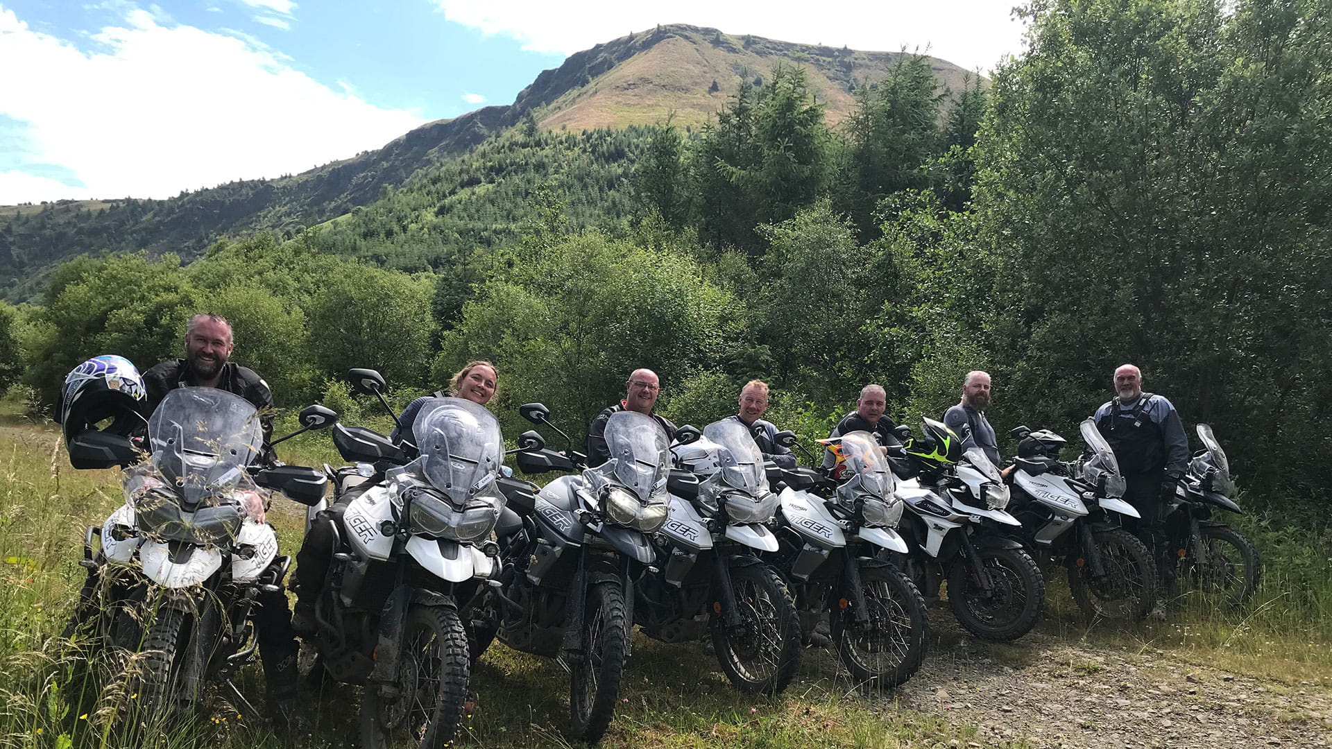 A group of riders on Triumph Tiger motorcycles during an experience day