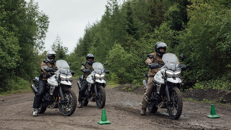 A group of riders on Triumph Tiger 800 preparing for the adventure training