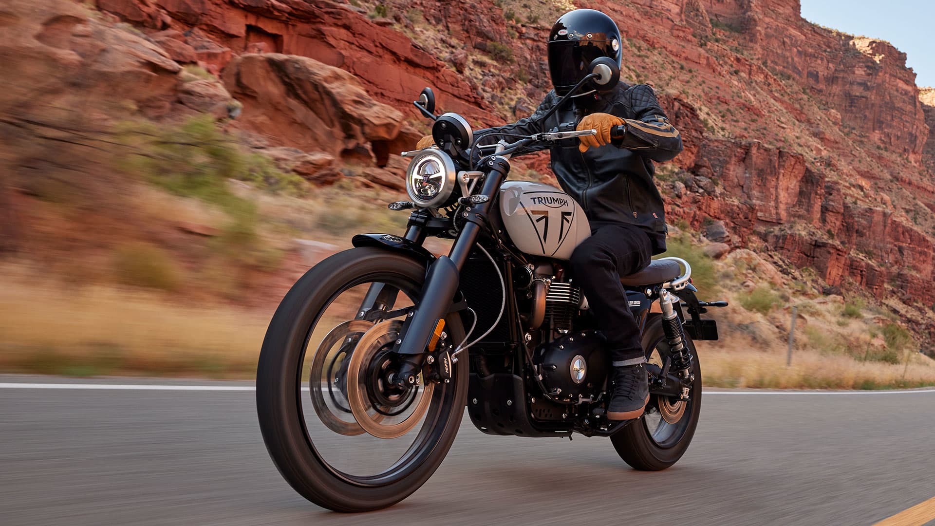 Triumph Scrambler 1200 X in Ash Grey riding shot