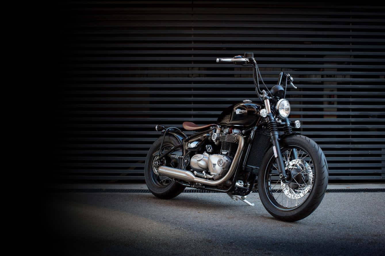 Triumph Bonneville Bobber infront of black shutter