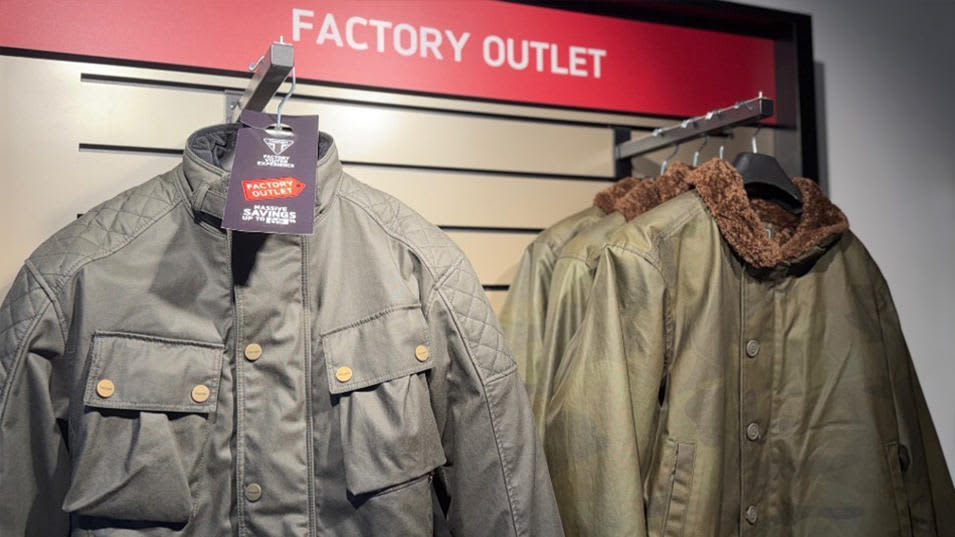 Factory Visitor Experience outlet stand with jackets hung up