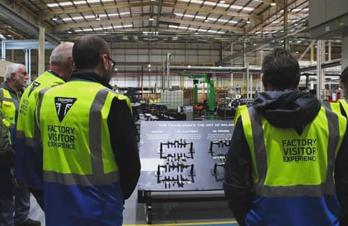 Triumph Factory Visitor Experience Factory with Workers in High Visibility Jackets