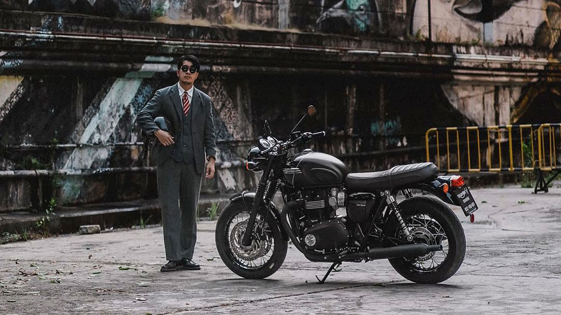 2023 DGR rider stood by Triumph Bonneville T120 Black