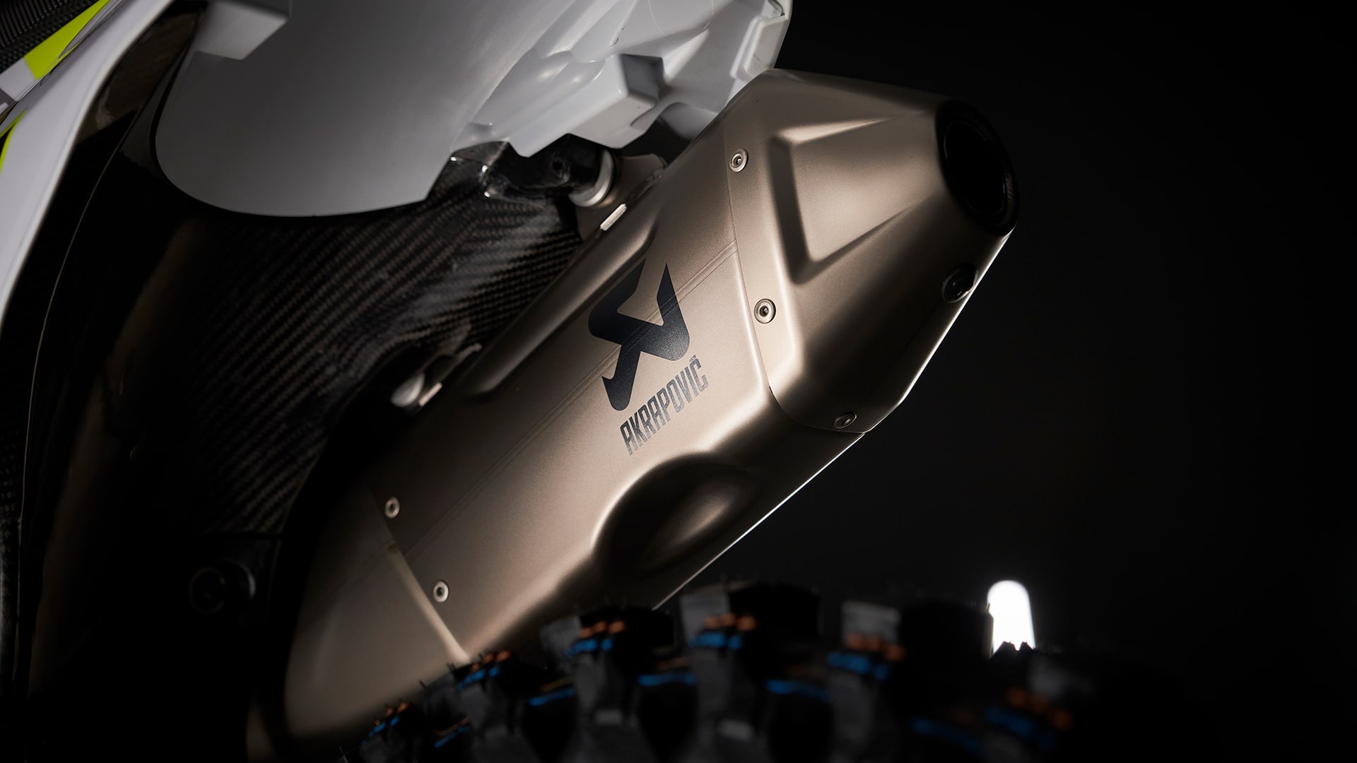 Triumph racing partnership with akrapovič TF 250-X motocross bike part closeup