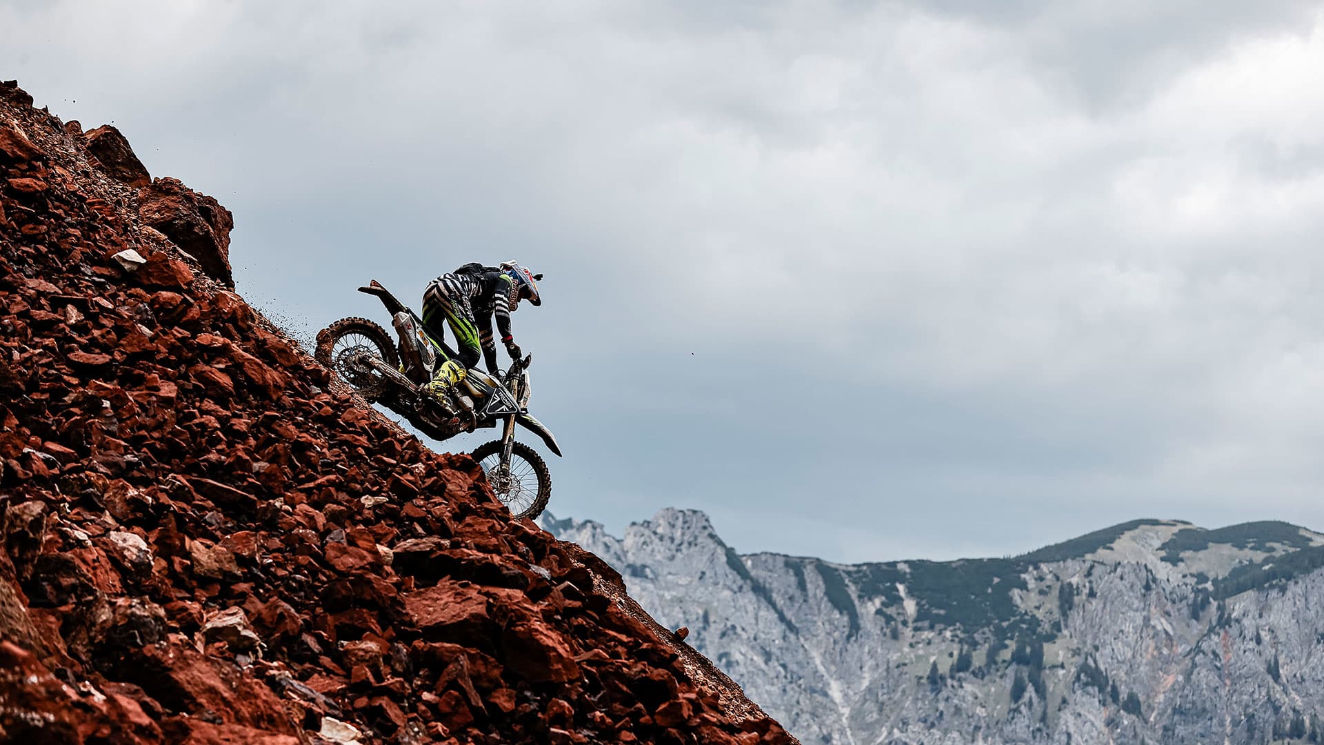 Jonny Walker at Erzbergrodeo on Triumph 250-E going downhill on a rocky track