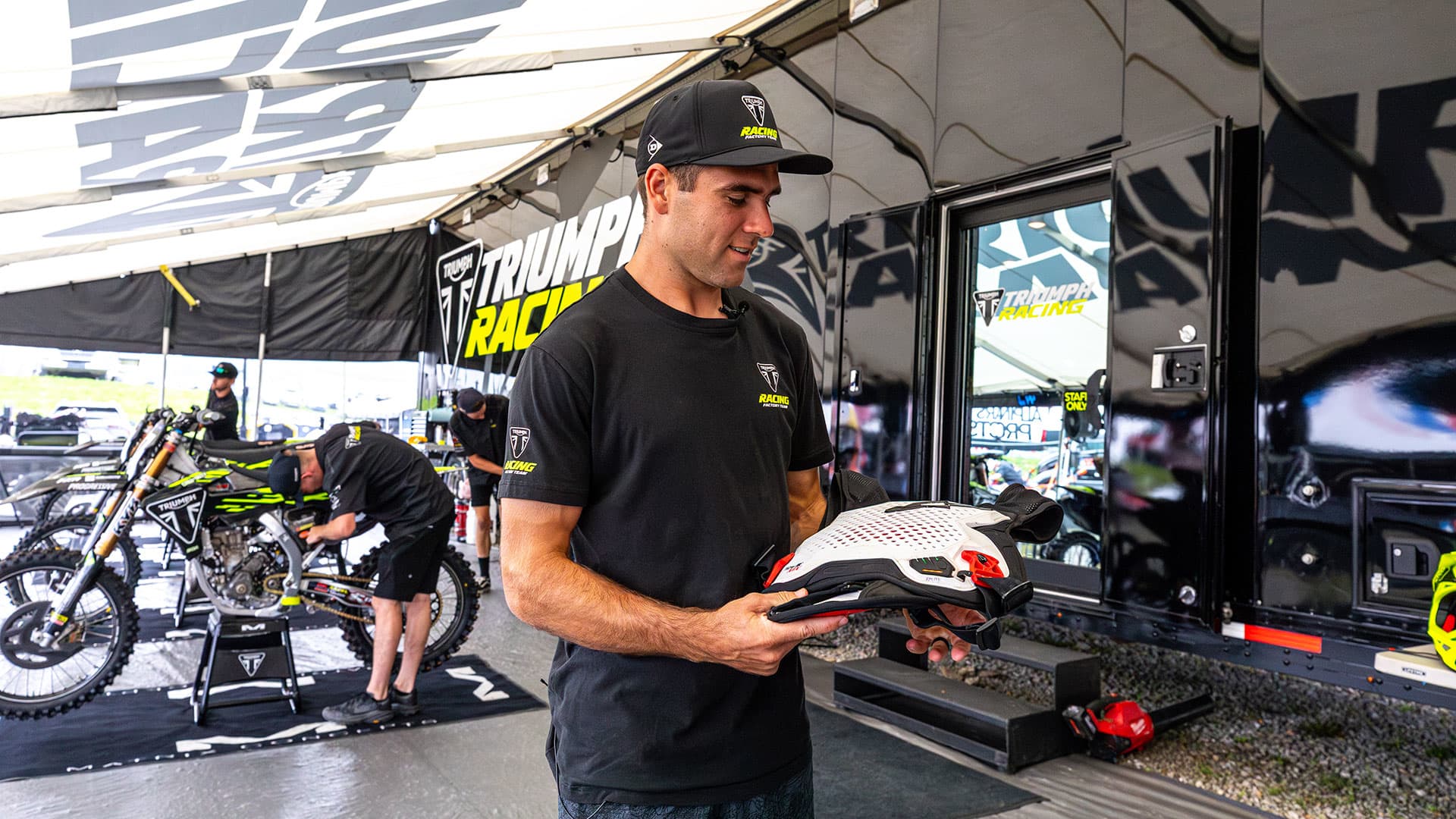 Triumph's Jordan Smith holding Alpinestars' TechAir MX airbag system