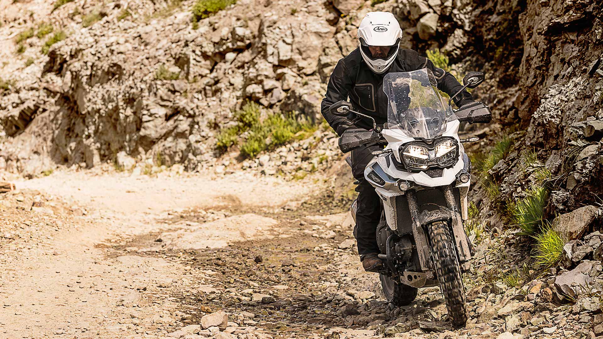 Solo rider experiencing off-road adventure riding on the Triumph Tiger 1200 XCA