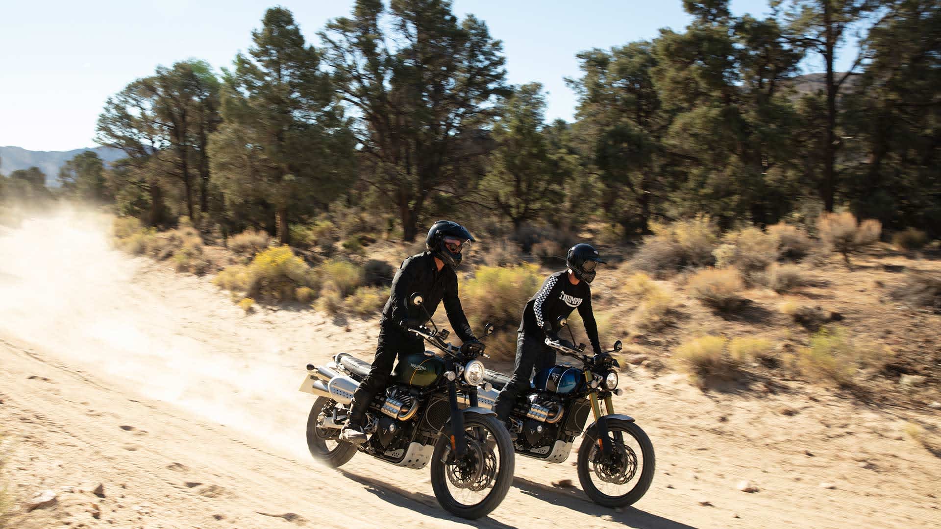 Triumph riders on the Scrambler 1200 trailing a dried up terrains