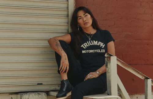 Woman wearing Triumph Official Merch Tee