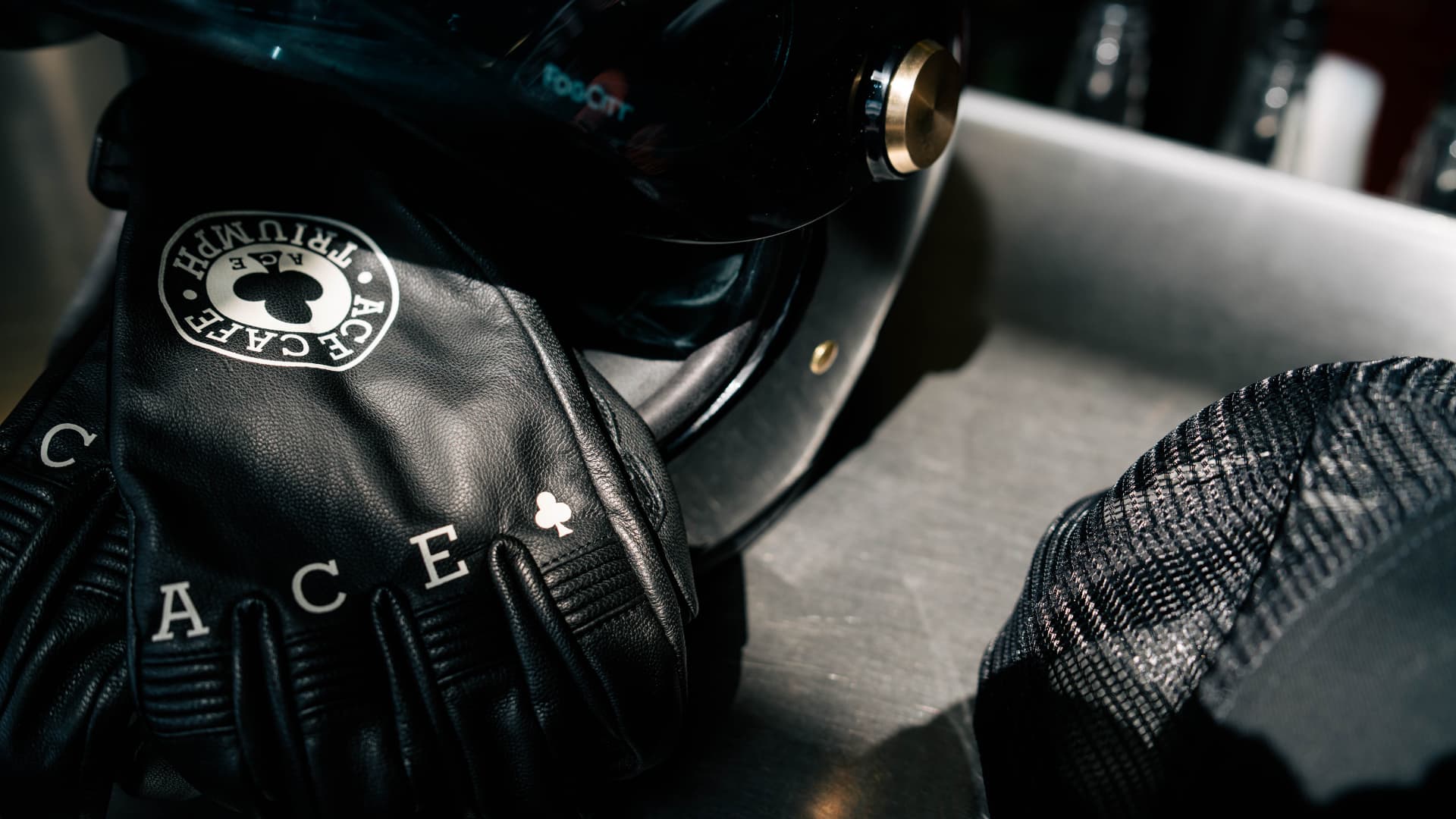 Motorcycle helmet with Ace Cafe Triumph Cap and Gloves
