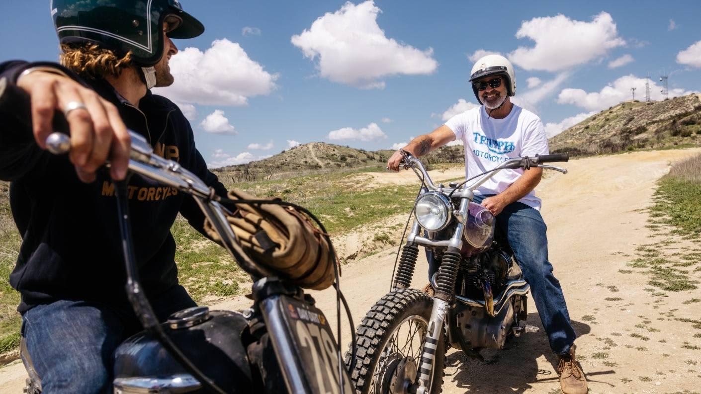 Lucky and Gille on their Triumph Bikes wearing Triumph Heritage clothing