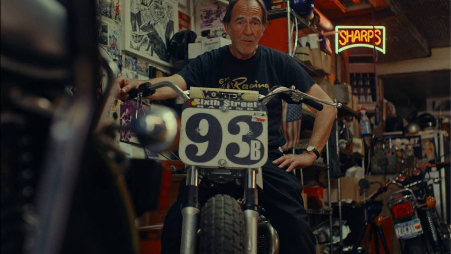 Sixth Street Specials Garage Hugh Mackie on a Triumph Bike
