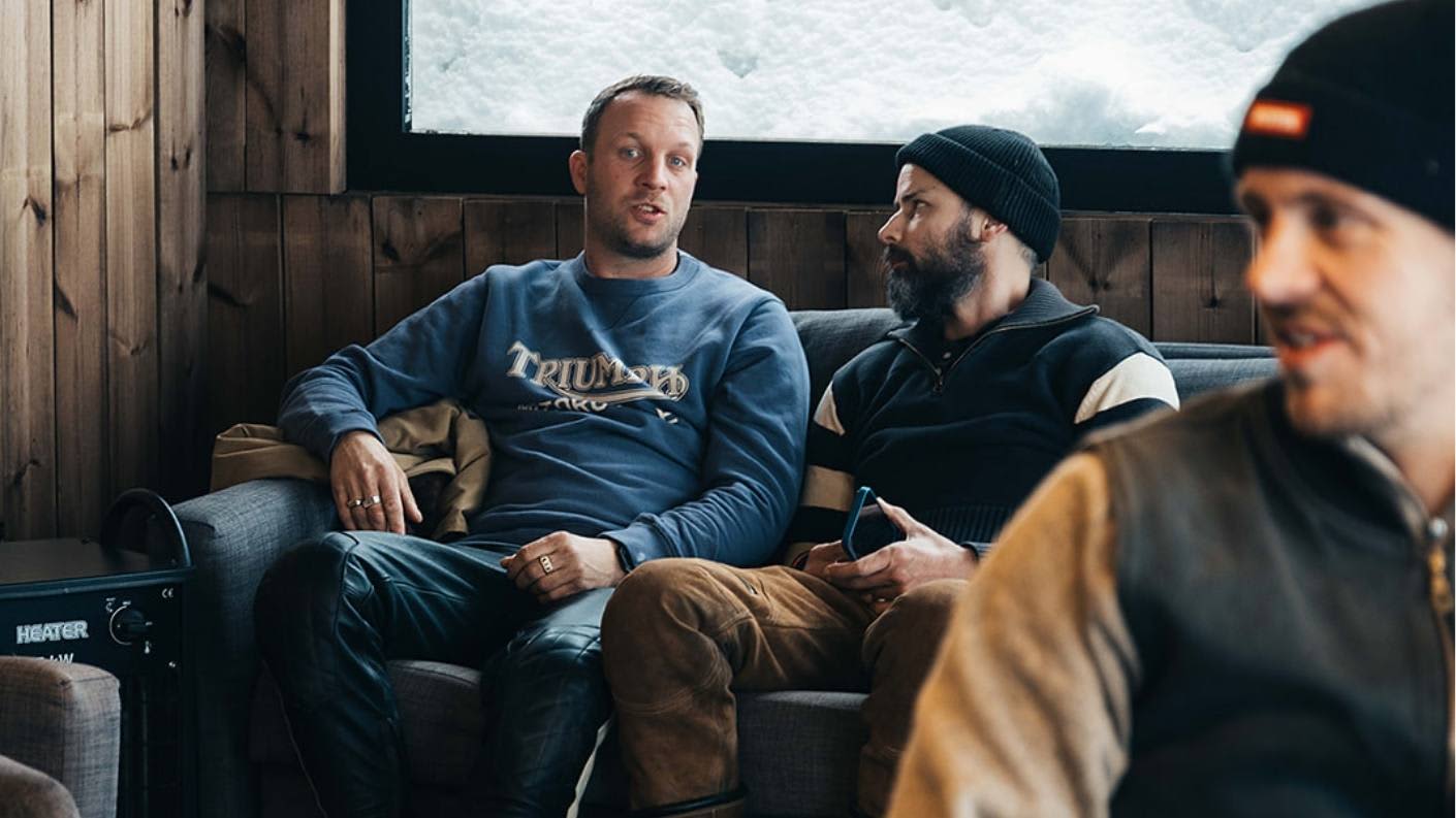 Jan at Swank on Ice rally briefing wearing Triumph's Radial Heavy Crew Sweat in Washed Indigo