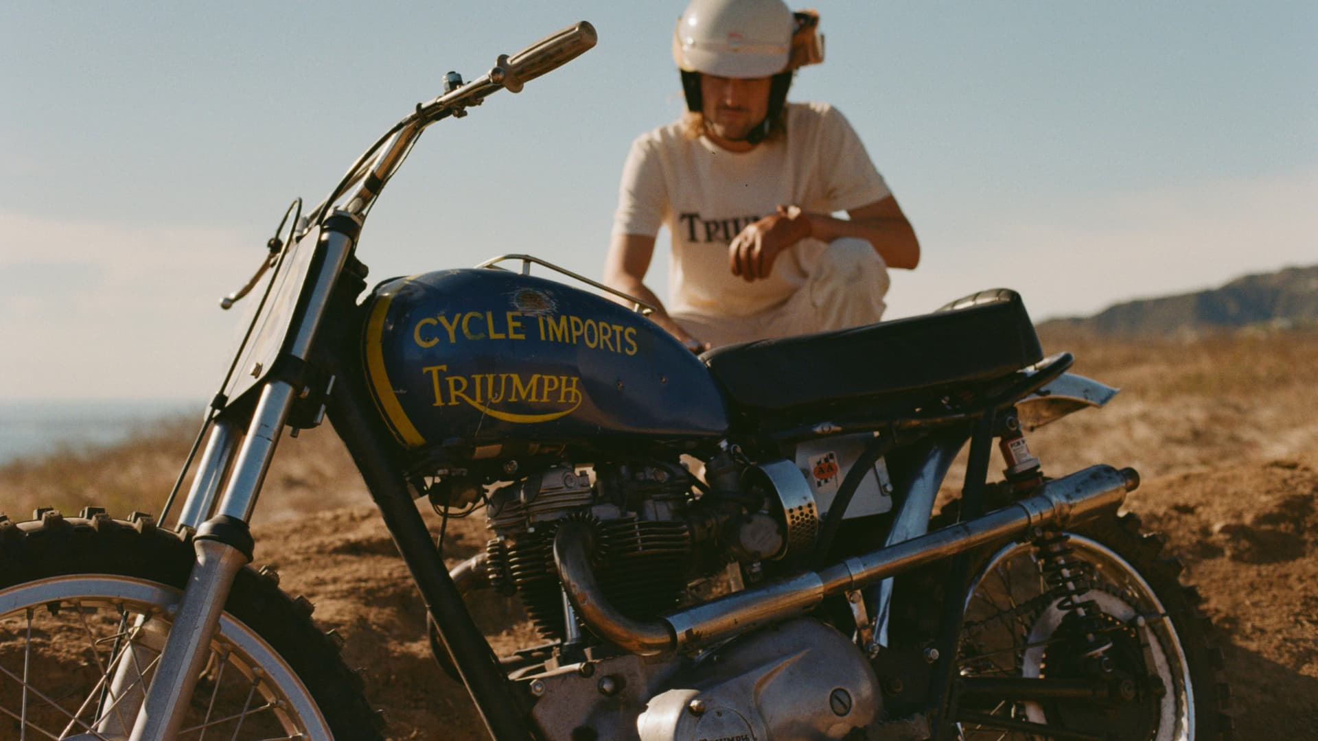 Man with Triumph Heritage Tee with TR6 bike