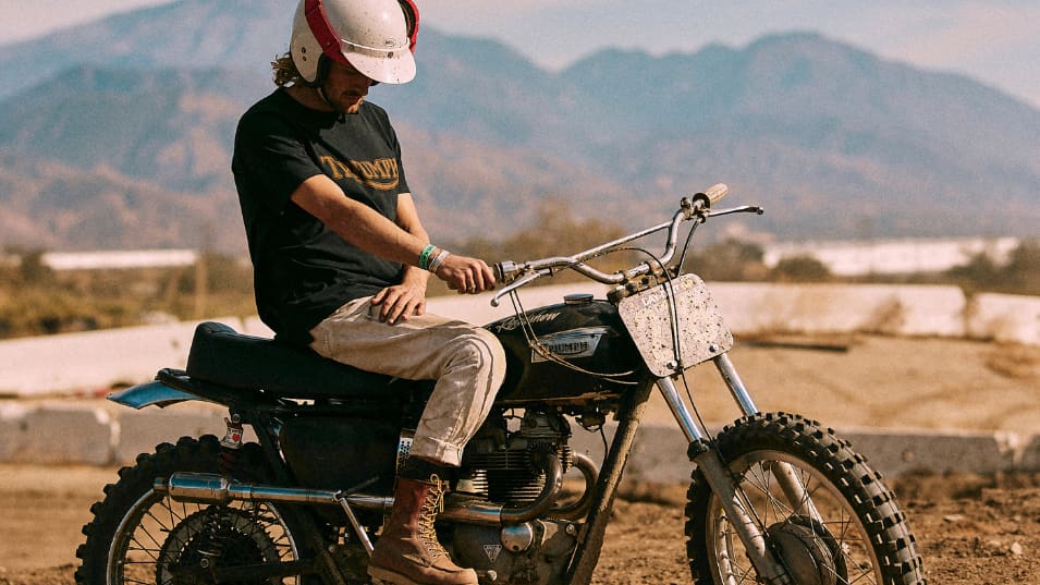 Man in desert on a Triumph wearing Fork Seal Tee