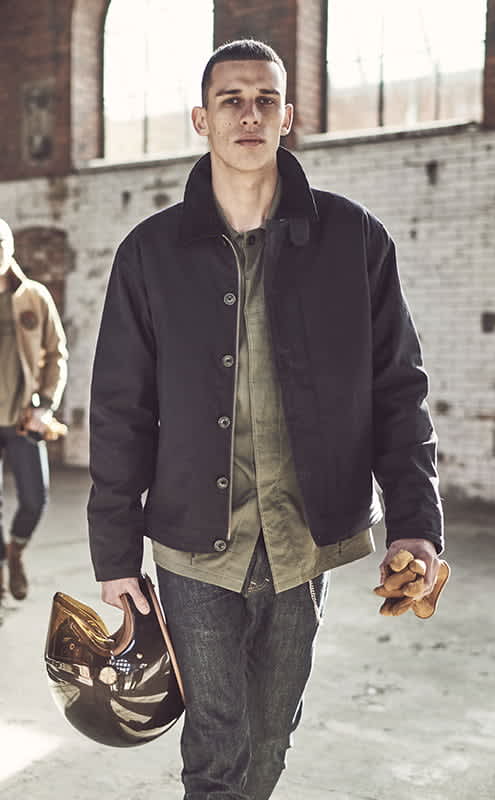 A man wearing a blue winter jacket