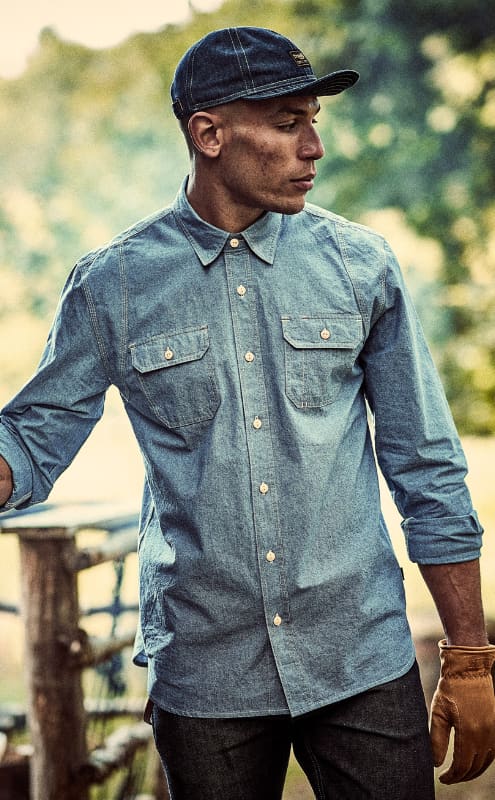 Man in forest wearing Triumph Life shirt