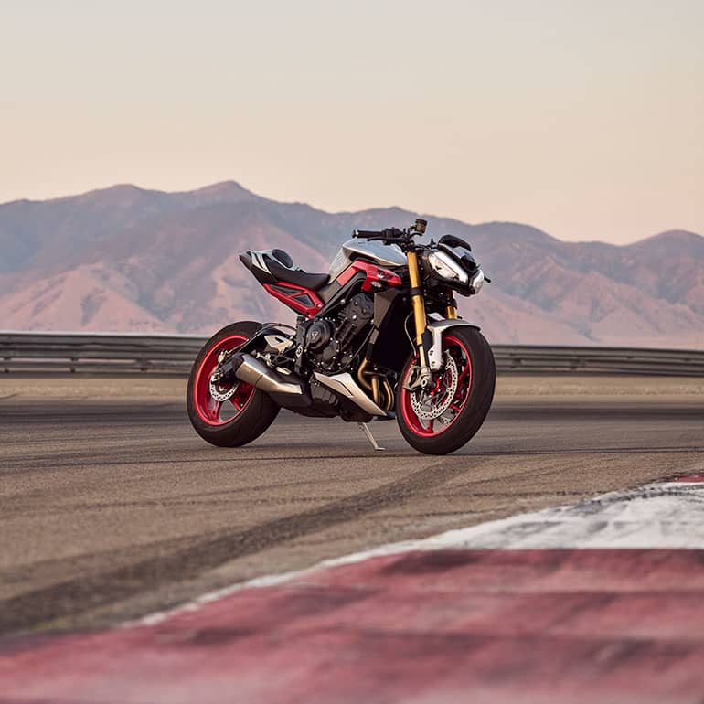 Triumph Street Triple RX parked on a track