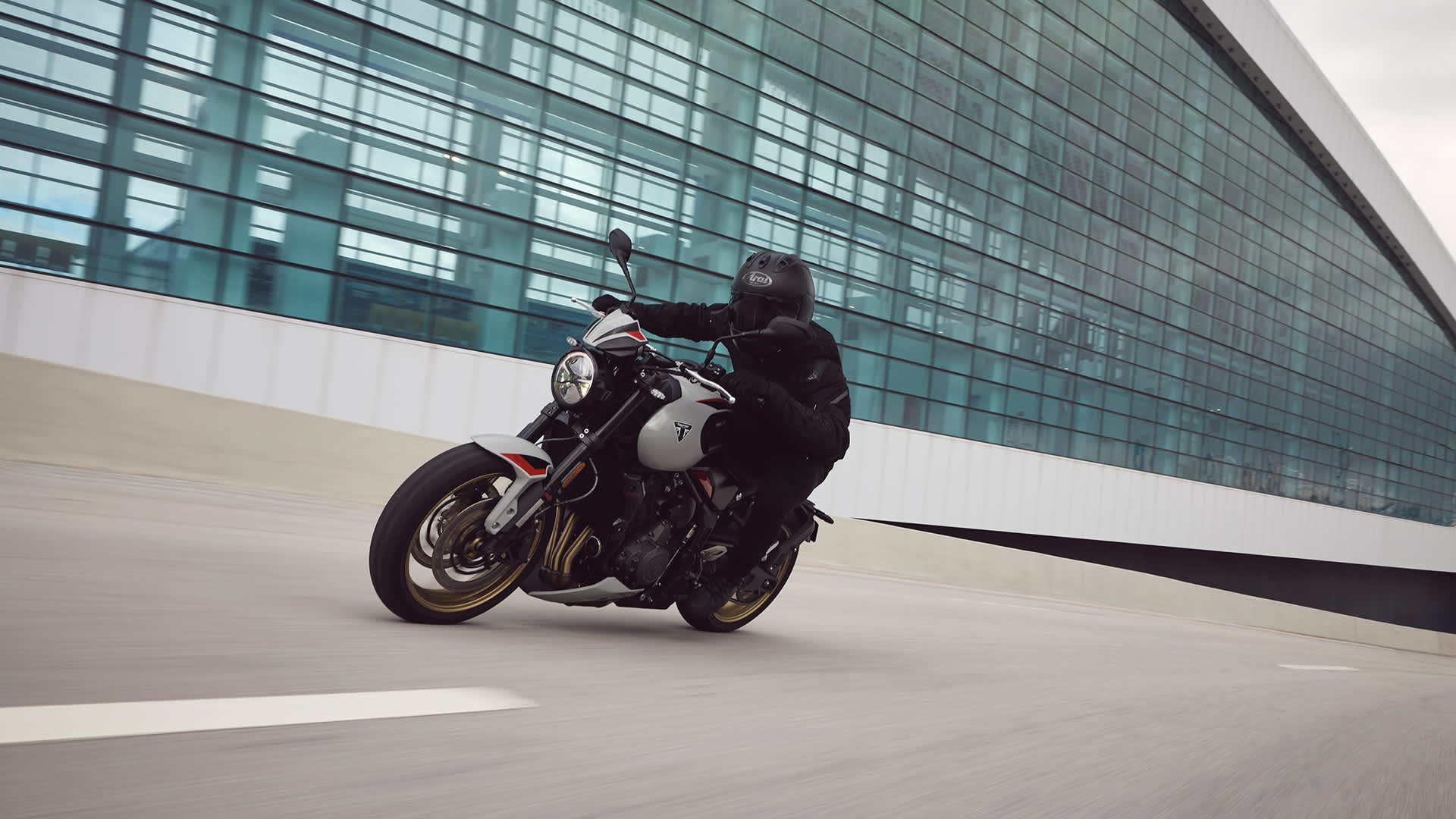 Angled side view of rider on Triumph Trident 800