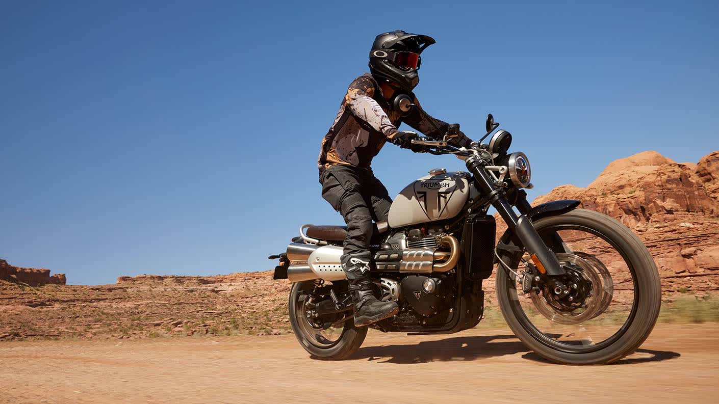 Triumph Scrambler 1200 X in Ash Grey riding off-road