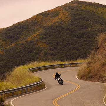 Triumph Speed 400 riding on twisty road