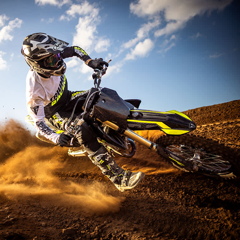 Triumph TF 250-X MY27 riding shot tracking up dirt