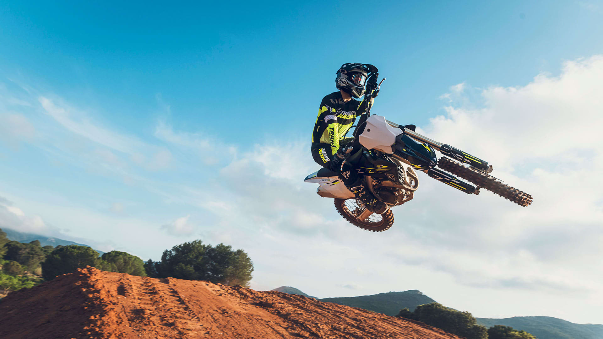 Motocross rider whipping Triumph TF 250-X