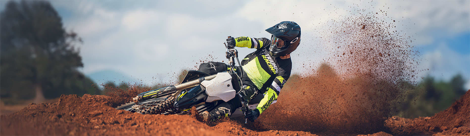 Motocross rider whipping Triumph TF 250-X)