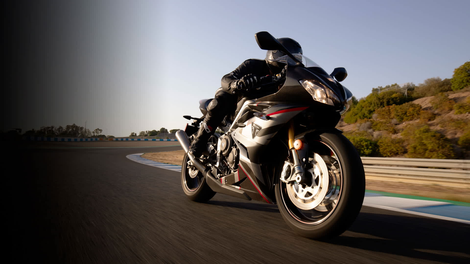 Triumph Daytona Moto2TM 765 motorcycle (USA) racing around a race track in Spain