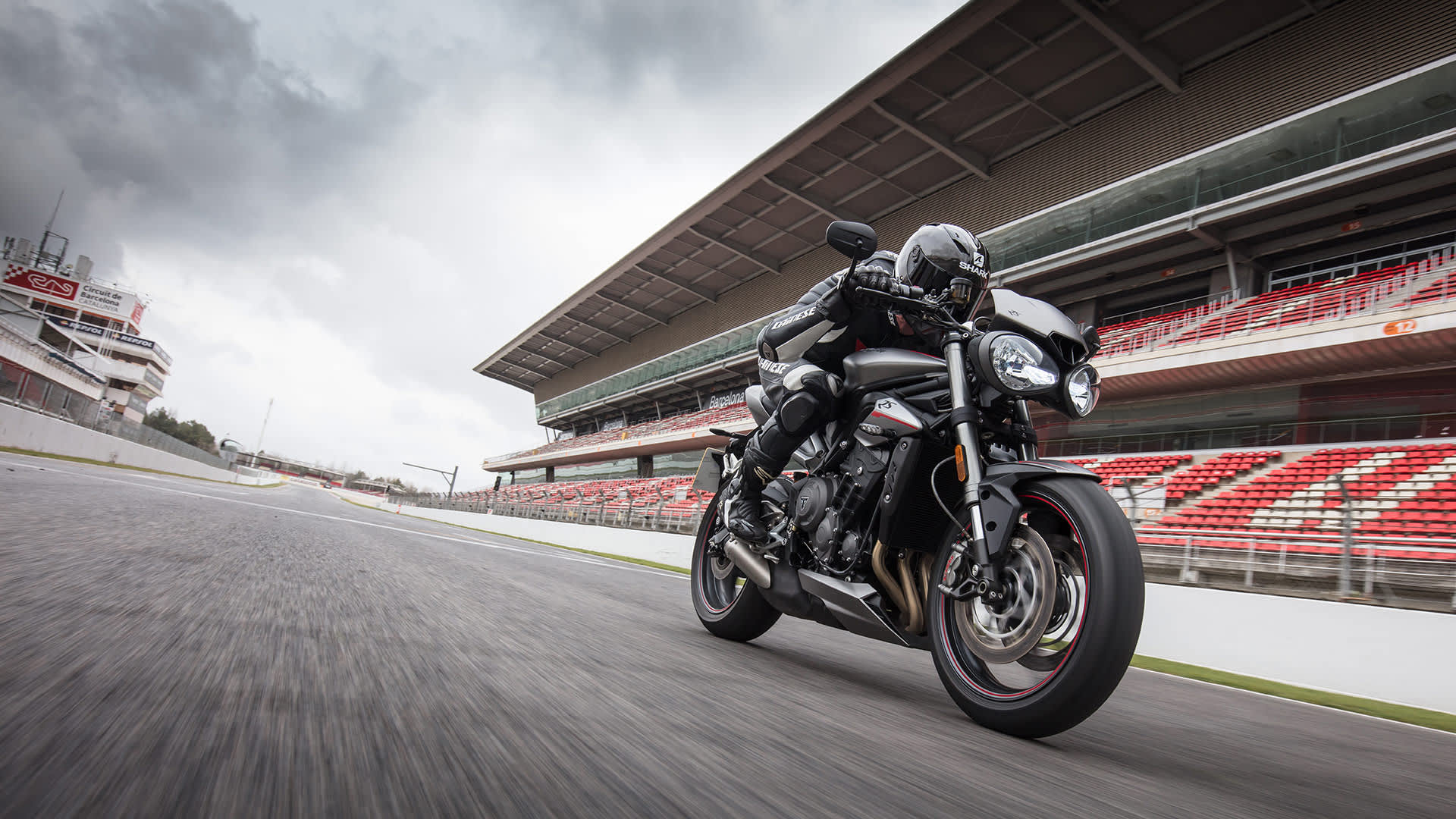 Triumph Street Triple RS motorcycle riding with speed on race track