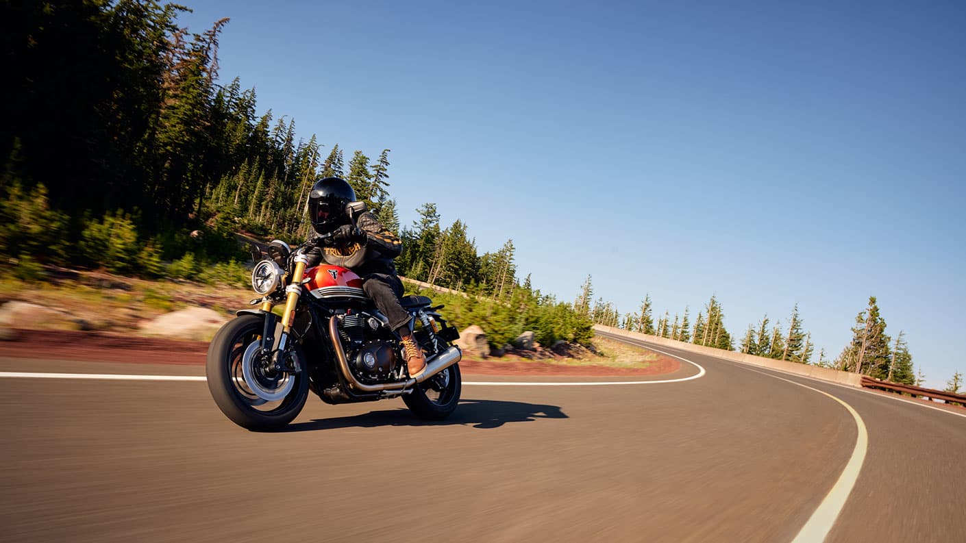 Triumph Speed Twin 1200 RS riding shot clear sky