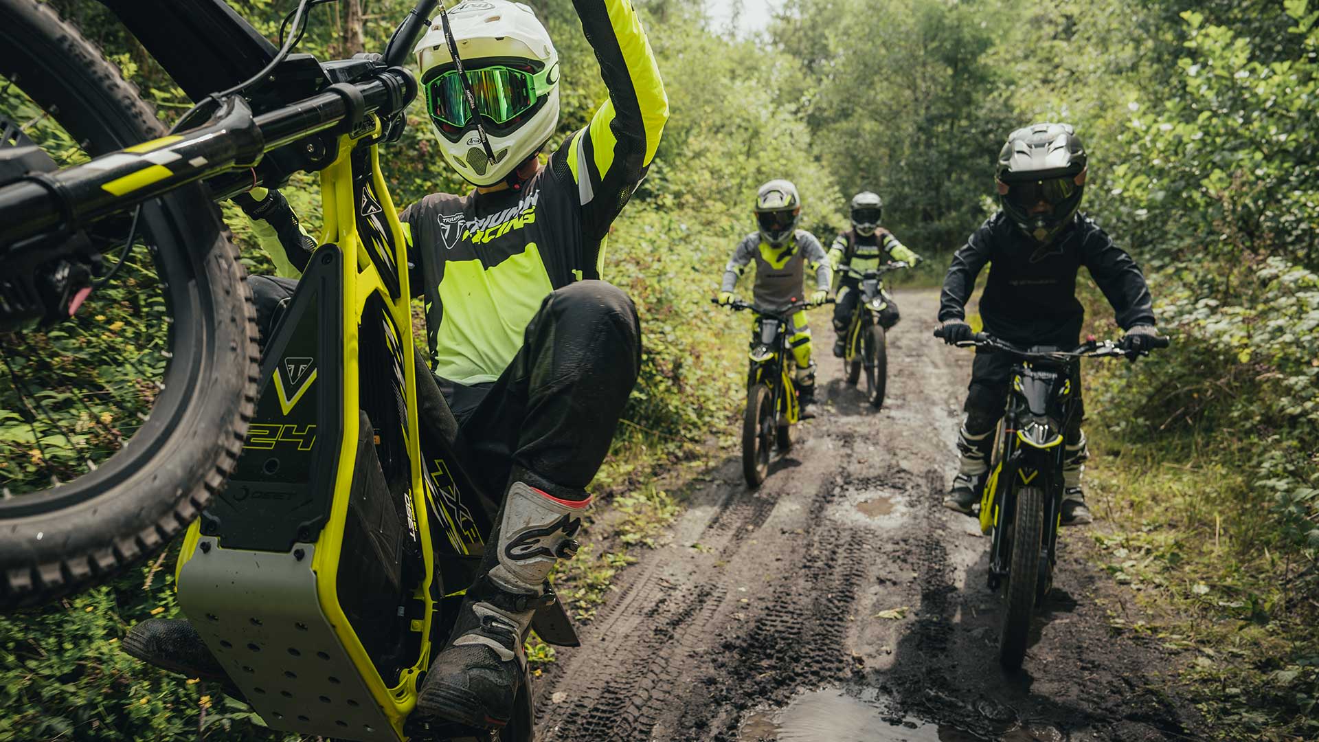 Triumph TXP powered by OSET bikes riding through a forest track