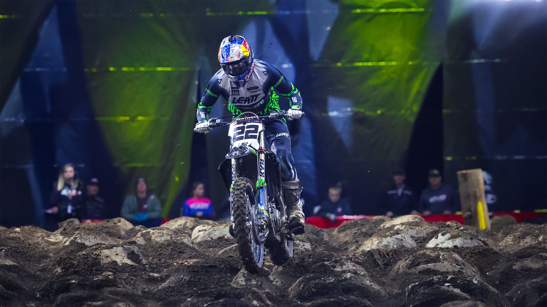 Rider on Triumph TF 450-E on a dirty and bumpy track