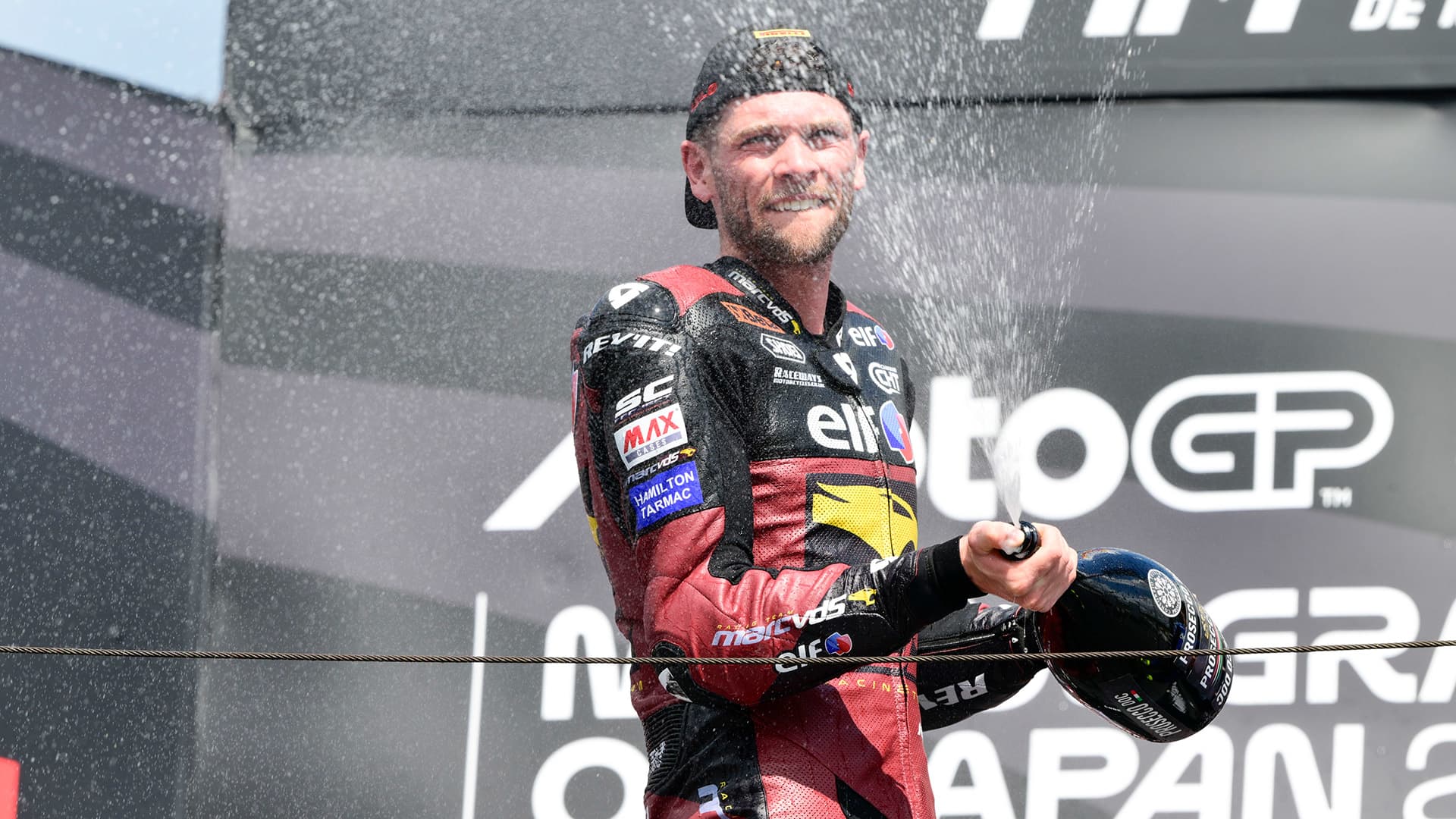 Man popping a bottle of champagne