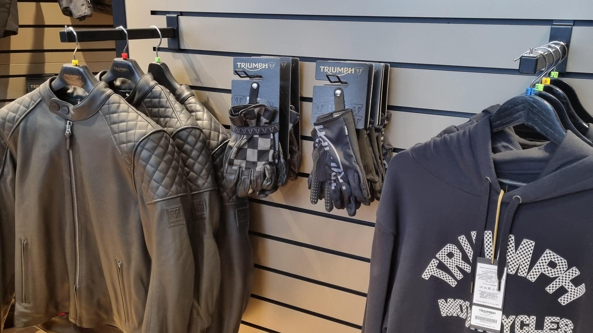 Triumph Gdansk dealership with jackets, hoodies and riding gloves