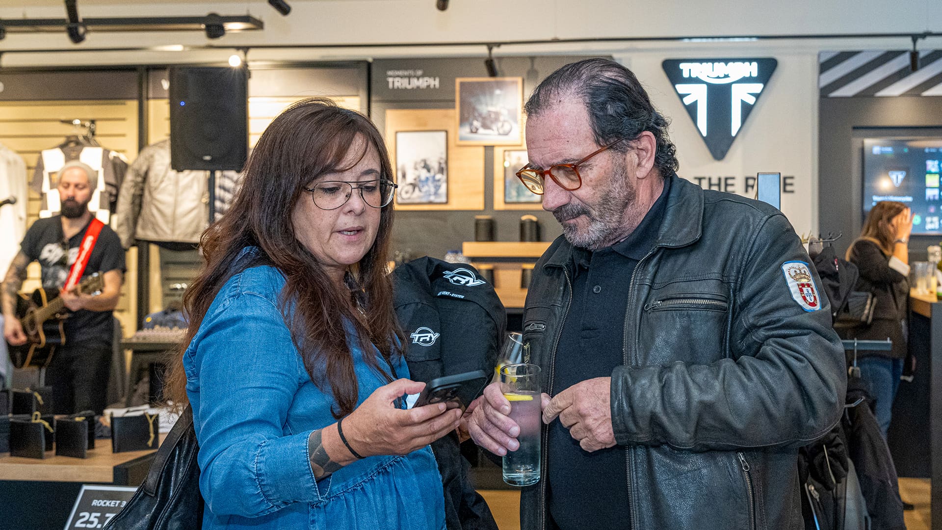 Two people having a discussion at Triumph porto