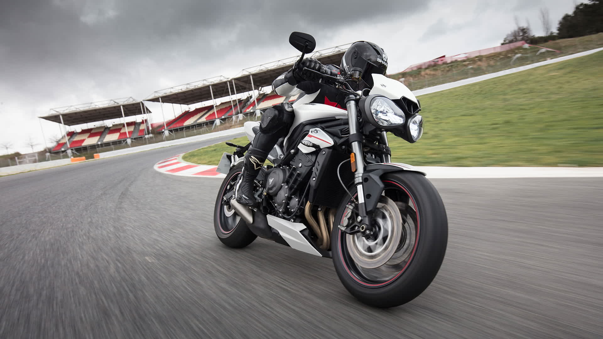 Triumph Street Triple corning on a track