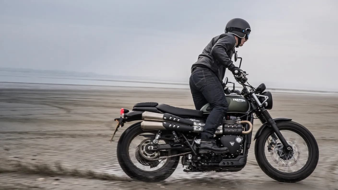 Triumph Street Scrambler on beach action shot