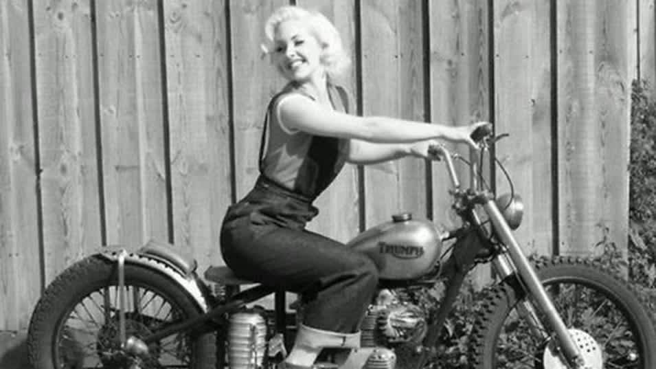 Retro image of lady on a old Triumph Motorcycle