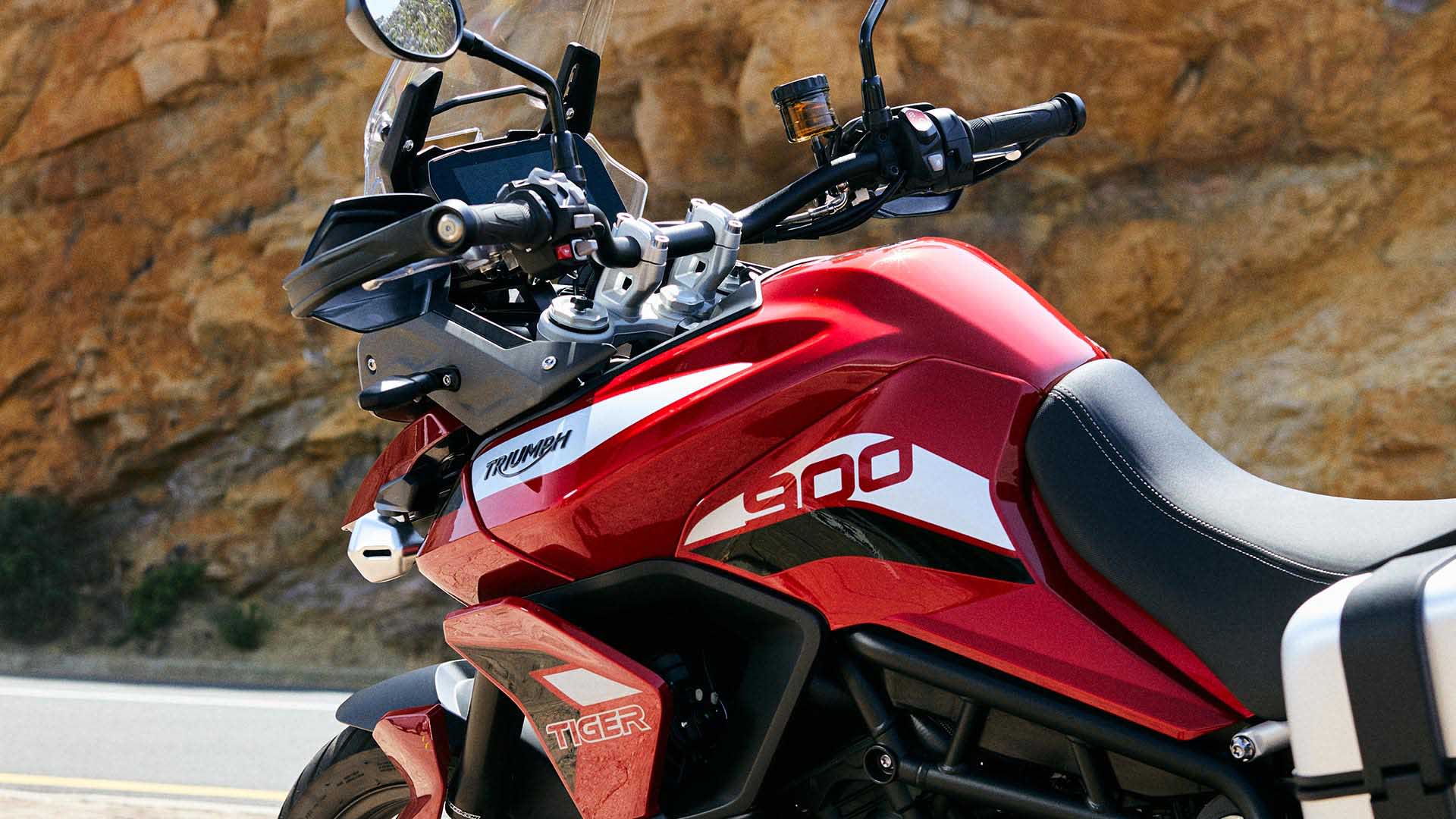 Close-up shot of Triumph Tiger 900 GT Pro in Korosi Red