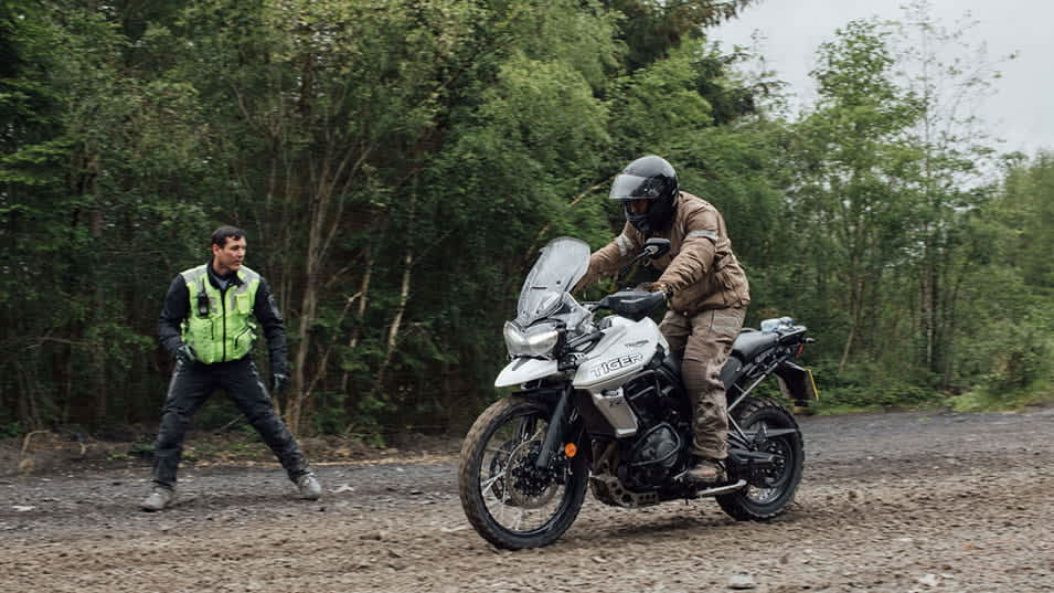 Training instructor motivating the rider on the Triumph Tiger 800