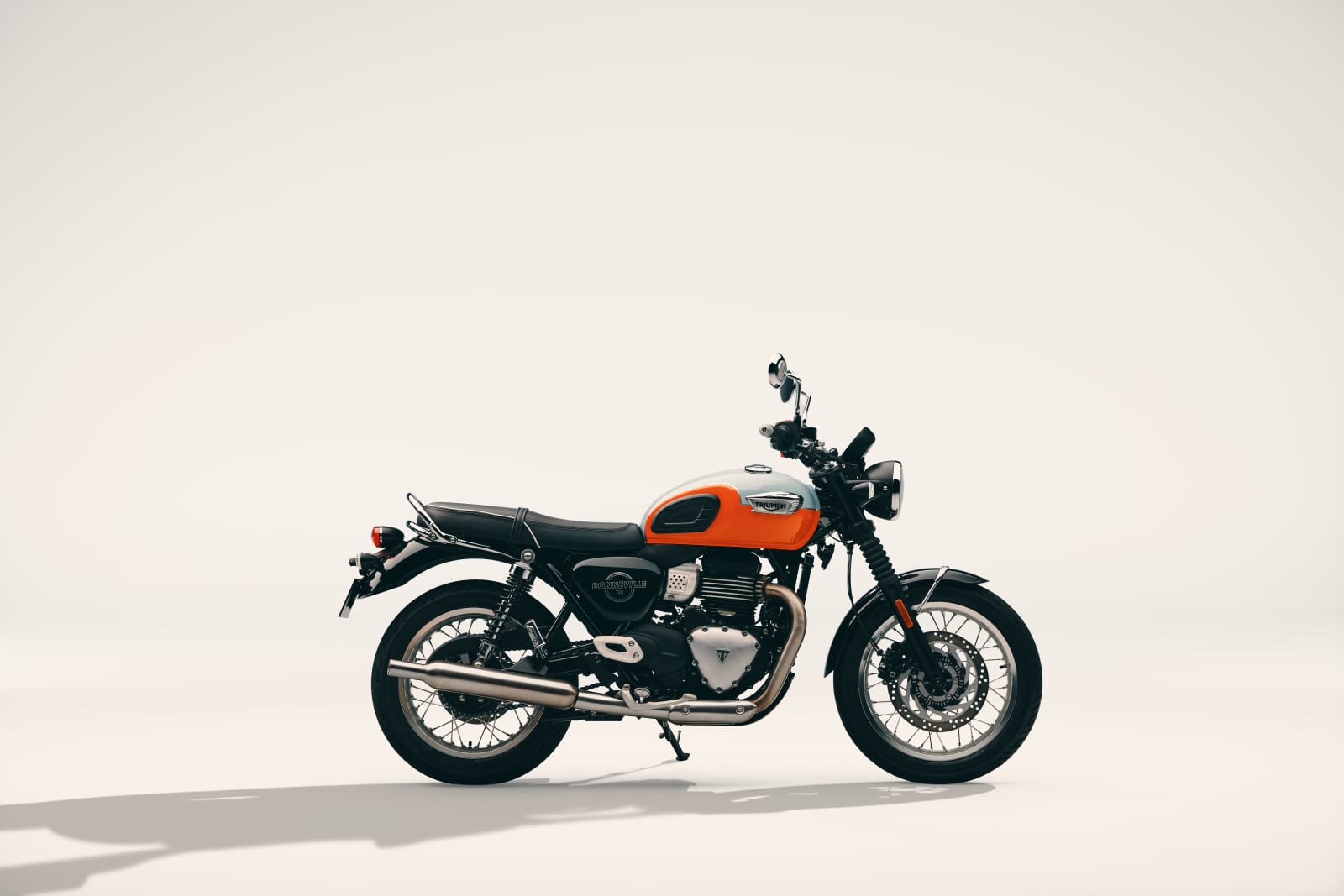 2027 Triumph Bonneville T40 in orange and pale blue, right side profile