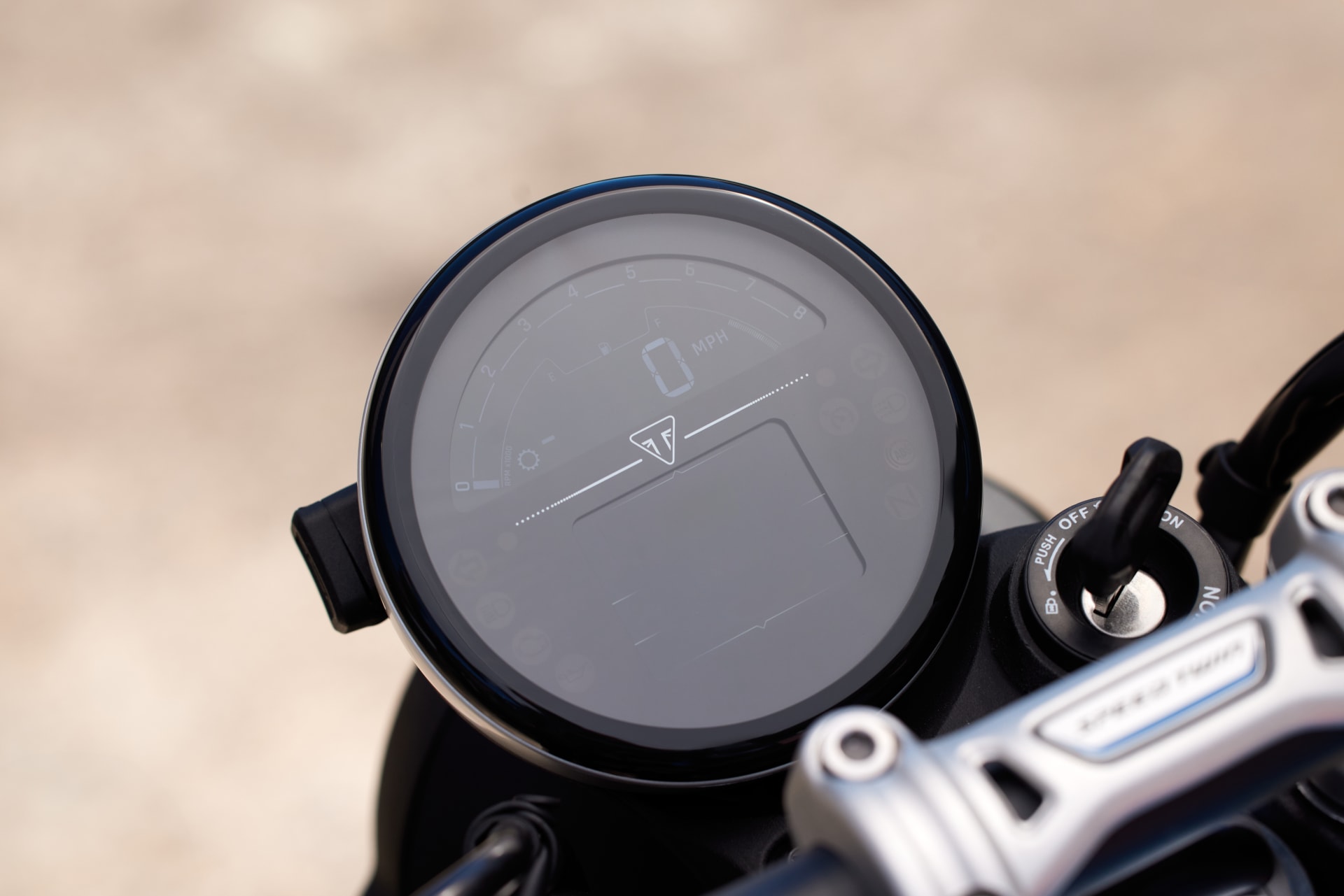Close up of Triumph Speed Twin 900 digital display and ignition switch