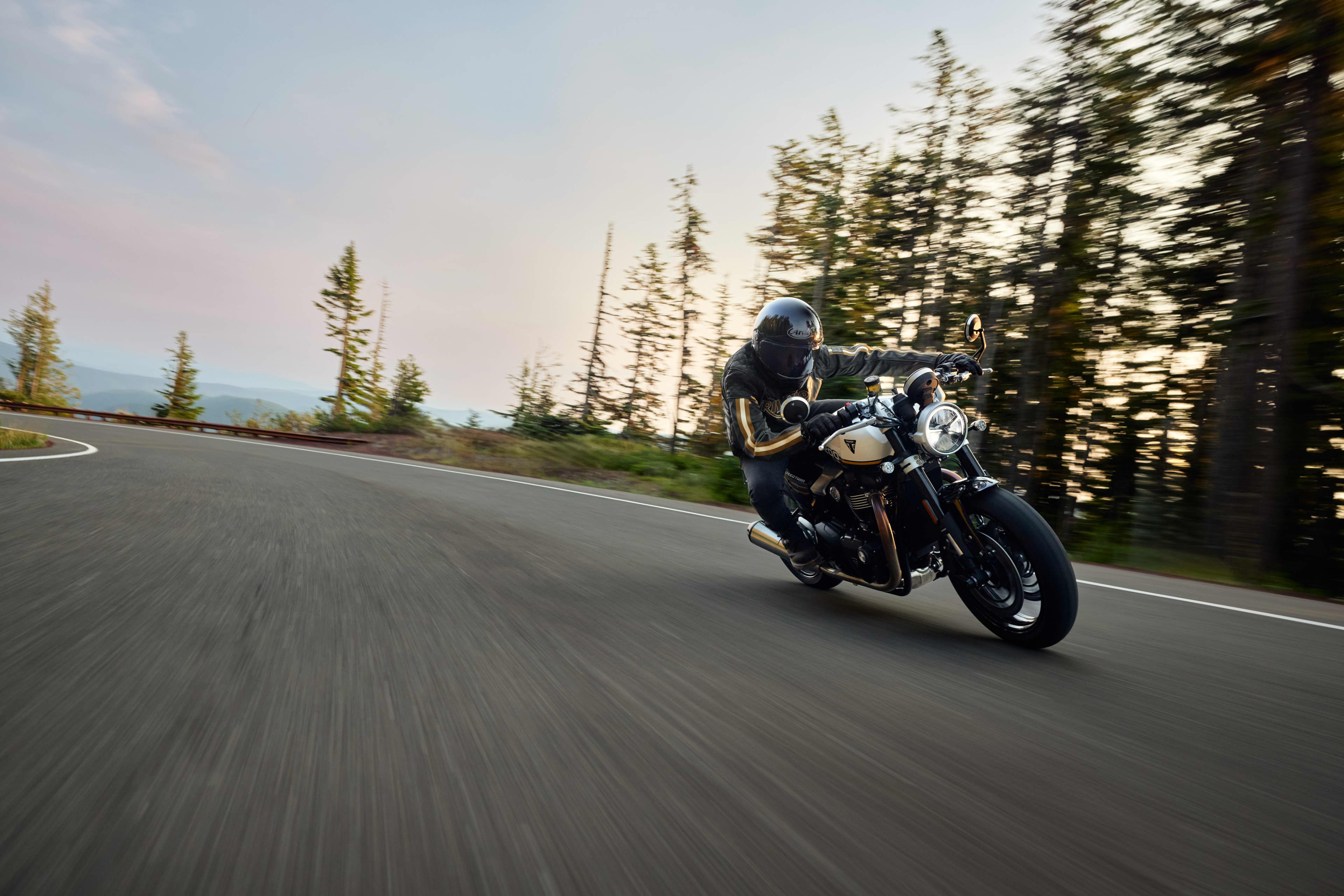 Angled front view riding shot of Triumph Speed Twin 1200